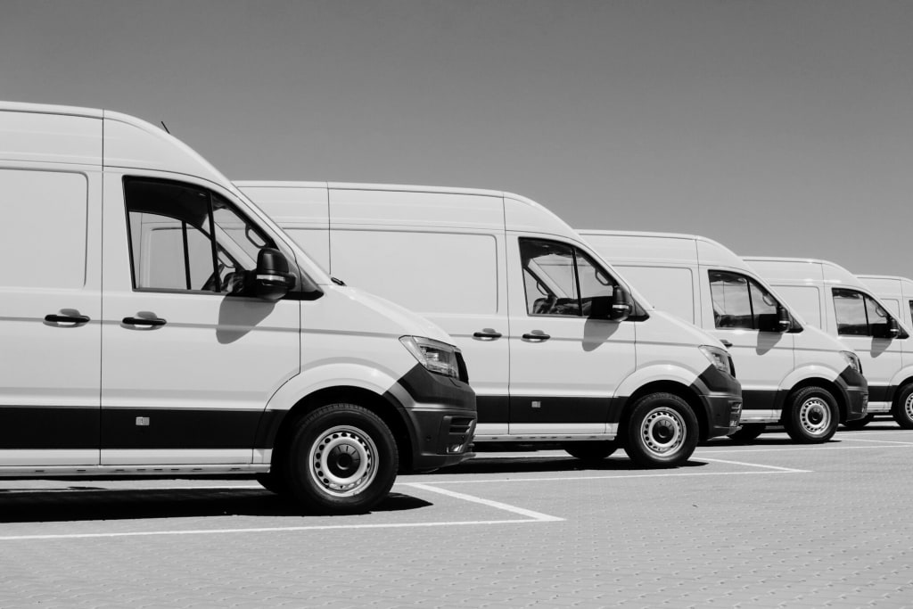 a line of white vans